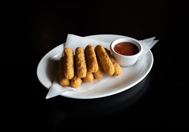 Golden fried mozzarella sticks with marinara sauce