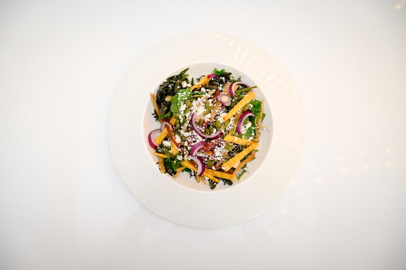 Garden fresh salad with colorful vegetables and vinaigrette