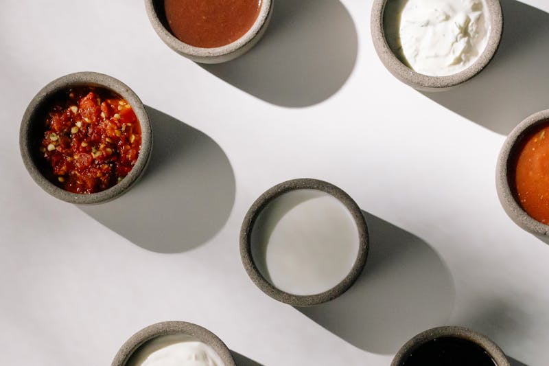 Assorted dipping sauces in small bowls